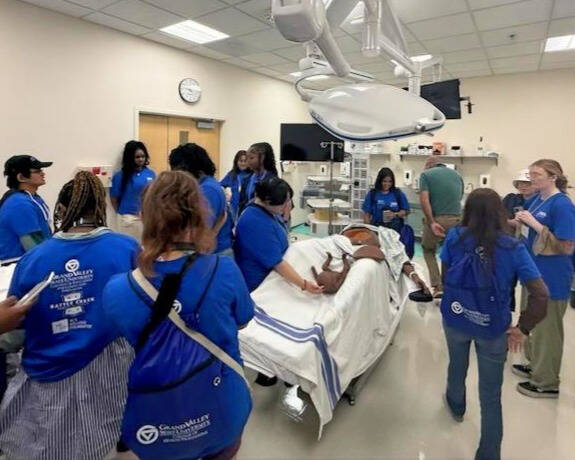 Battle Creek Central High students touring health simulation lab